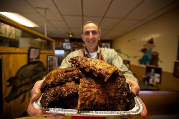 Abe's Bar-B-Q owner Pat Davis shows off his pecan-smoked BBQ Ribs in Clarksdale